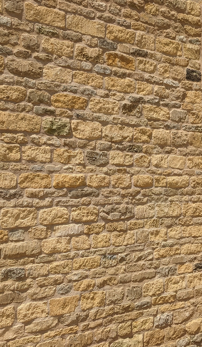 Reclaimed limestone laid in a wall