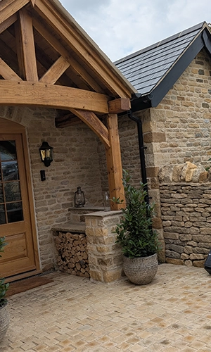 Reclaimed limestone house extension and dry stone wall