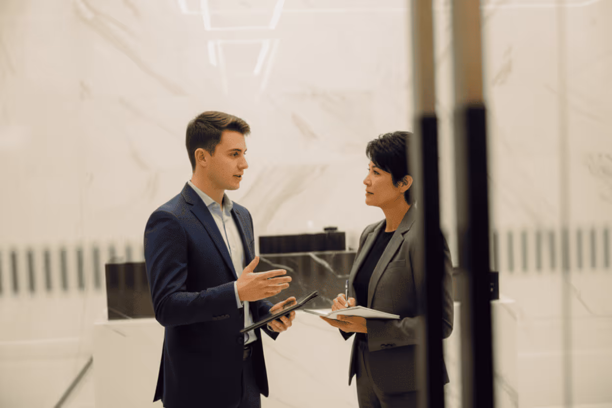 Customer picking up a serviced vehicle while advisor reviews the invoice