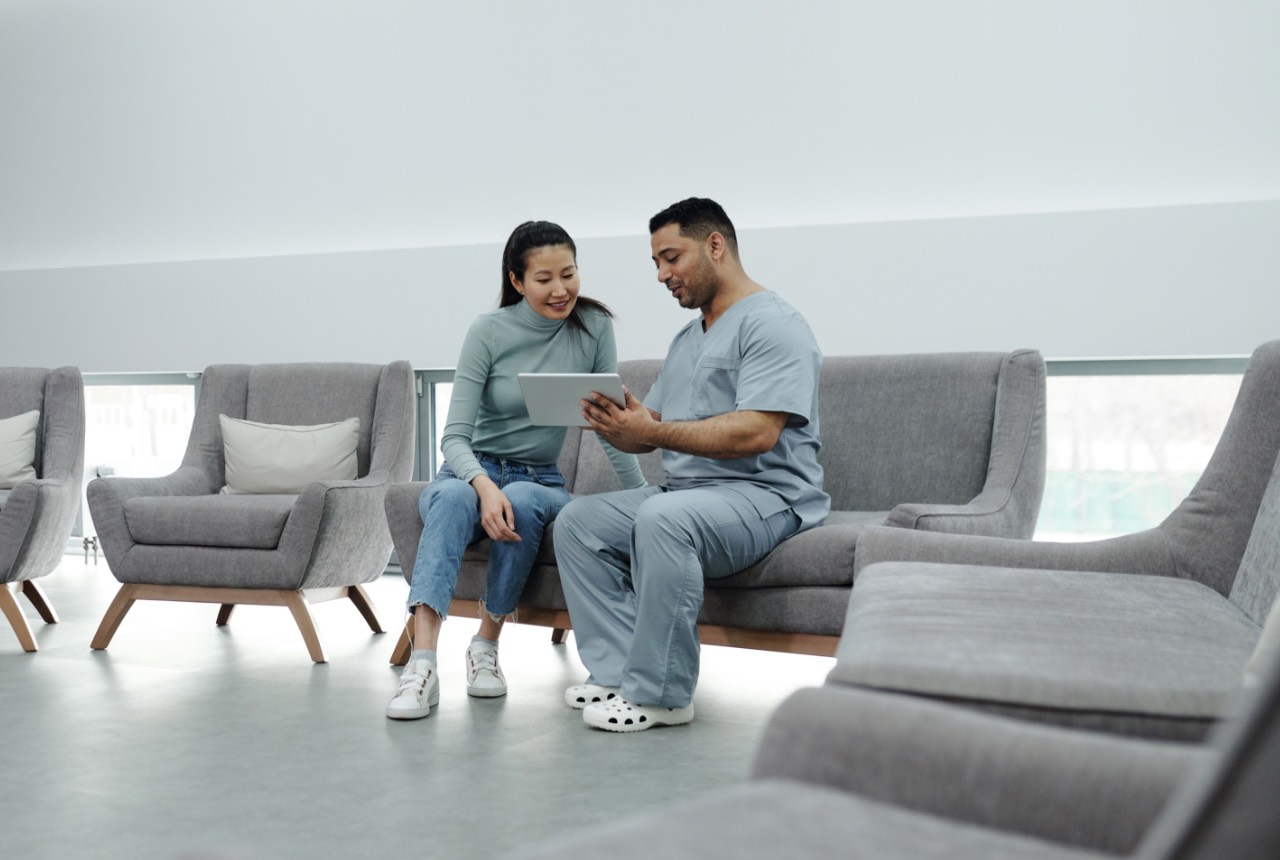 Patients seated together in a comfortable, modern dental office waiting area