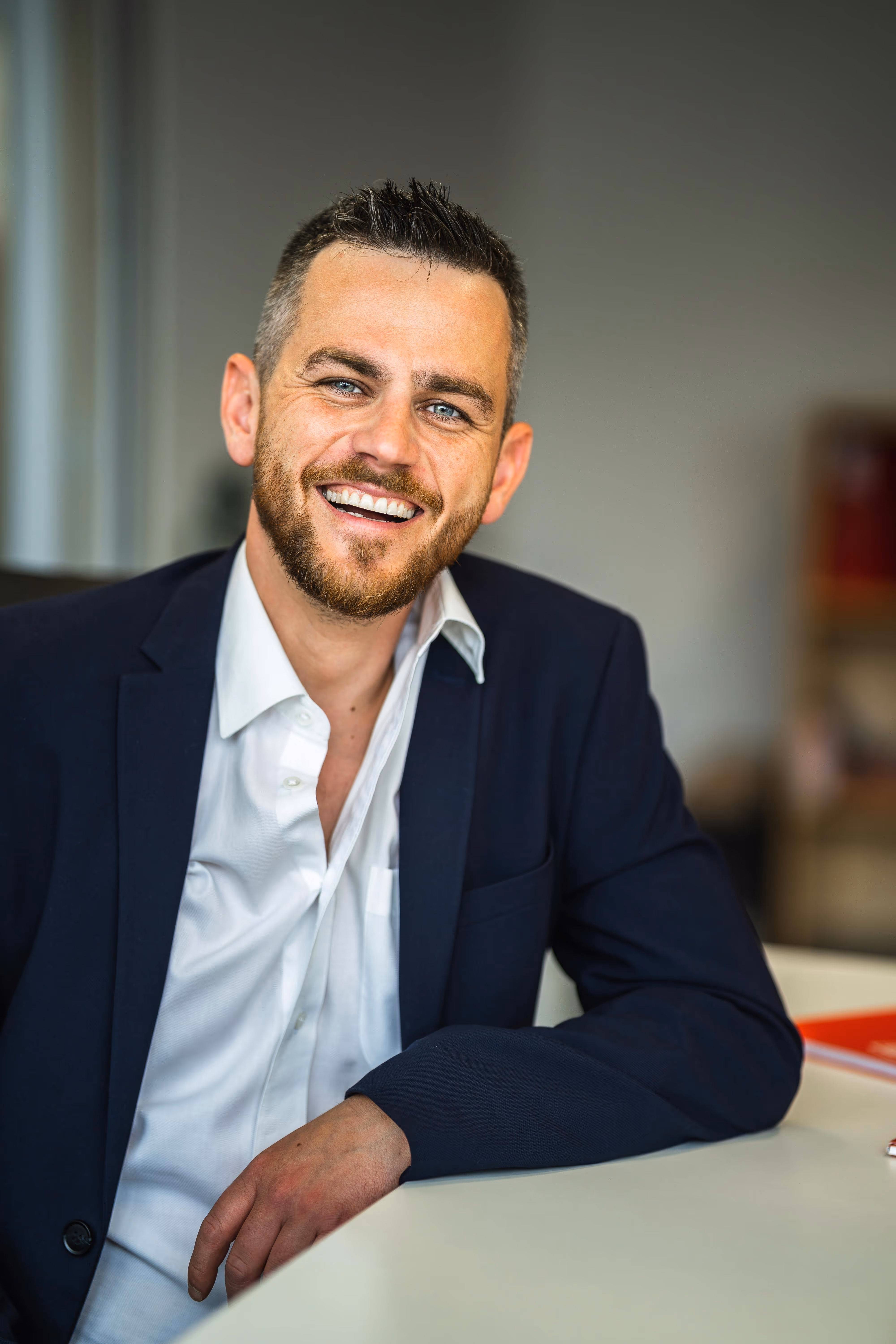 a portrait of a smiling handsome business man in the office