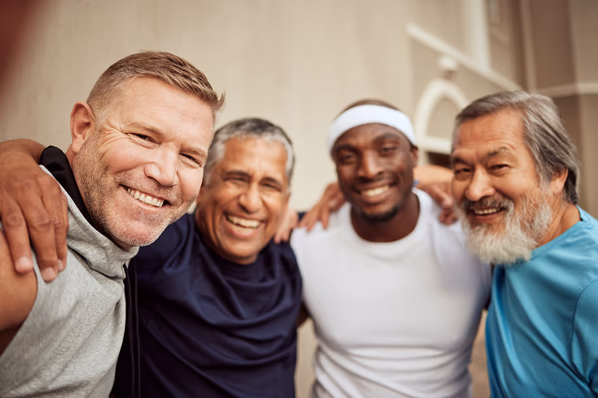 a group of men who are happy and friends taking a selfie