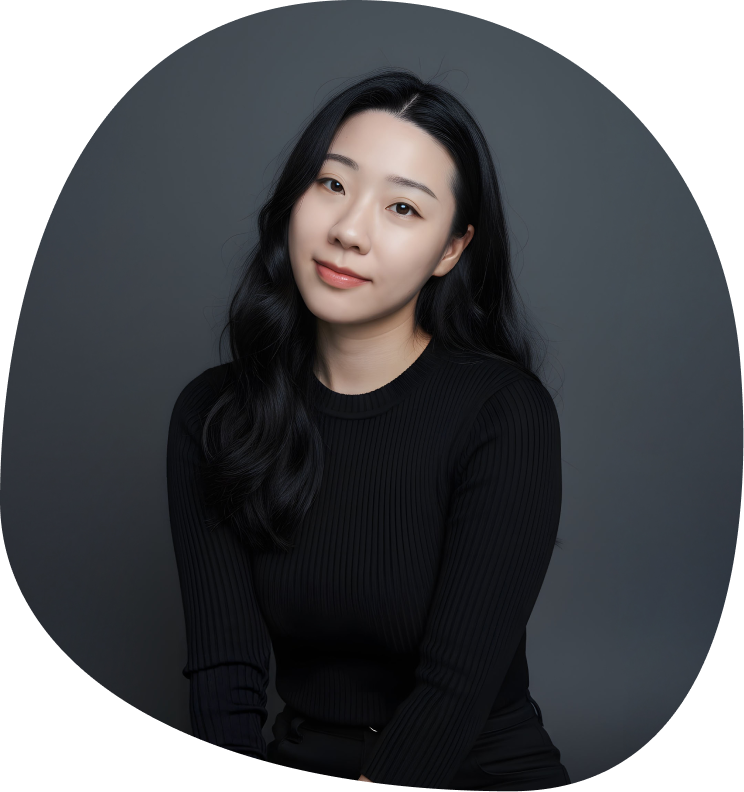 Young woman with long black hair wearing a black ribbed sweater against a dark gray background.