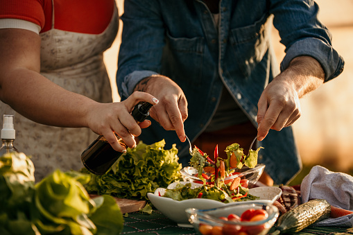 Two people preparing a meal together