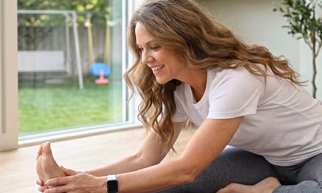 Woman stretching at home