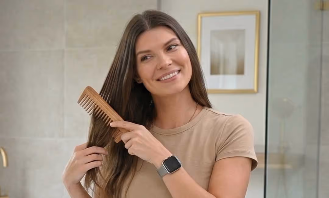Woman combing her hair