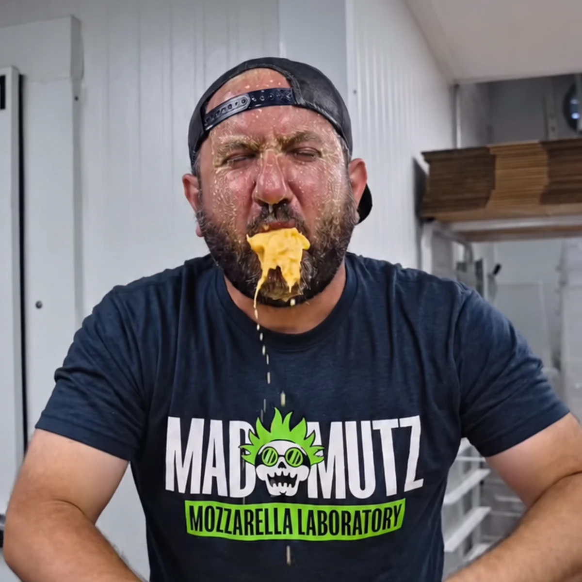 Mad Mutz founder Mike Hauke with melted cheese dripping from his face