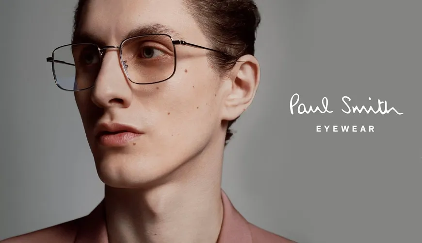 Model wearing stylish metal-framed glasses from Paul Smith Eyewear collection