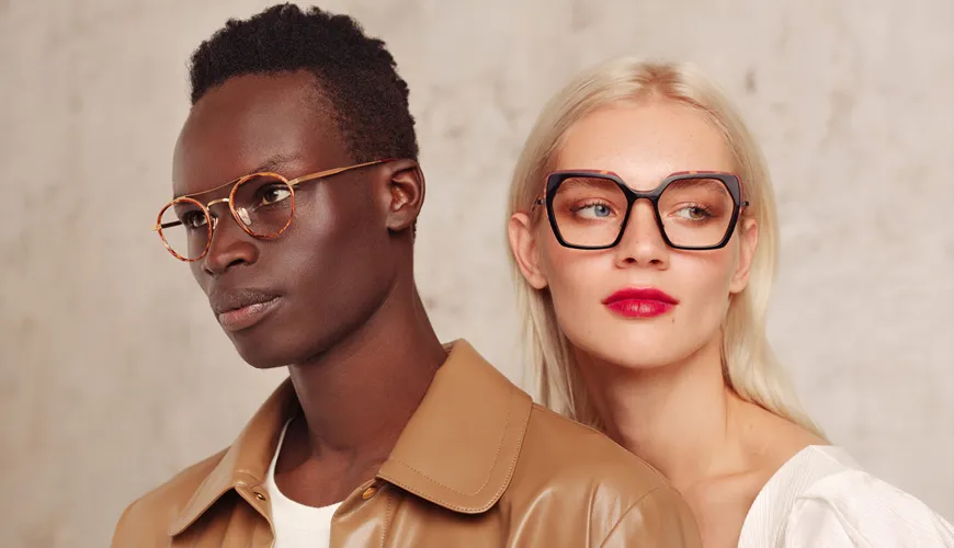Two people wearing stylish glasses against a neutral background