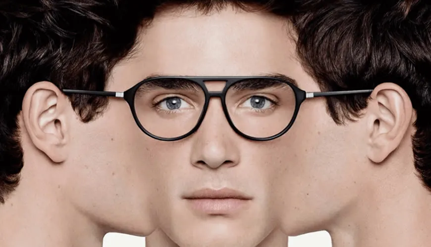 Person with curly hair wearing black-rimmed glasses, symmetrical portrait
