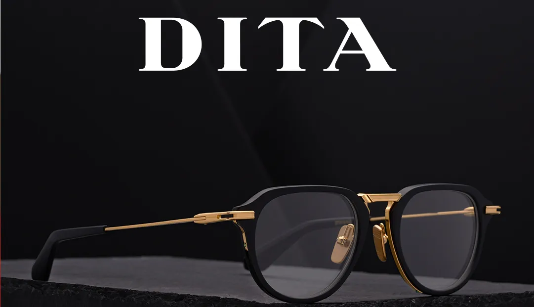 Sleek black and gold Dita eyeglasses on dark textured background
