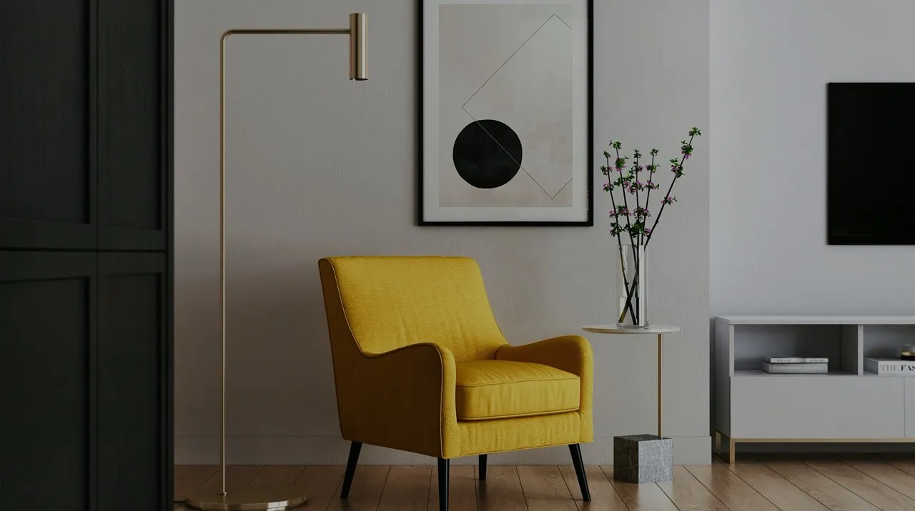 Modern living room corner with a mustard yellow armchair, floor lamp, small side table with a vase of flowers, abstract wall art, and white TV cabinet with books.