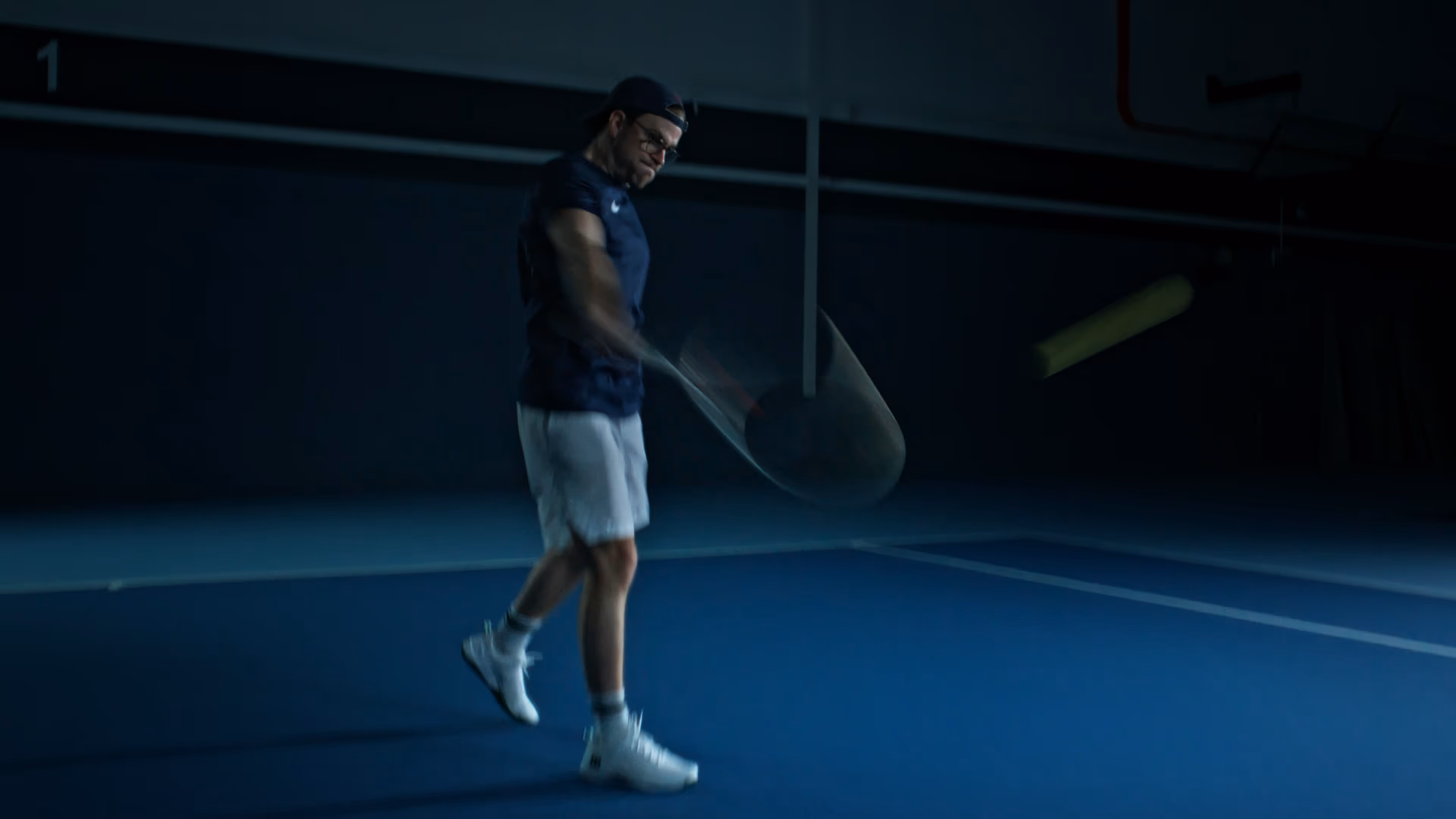Man hitting a ball on the tennis court