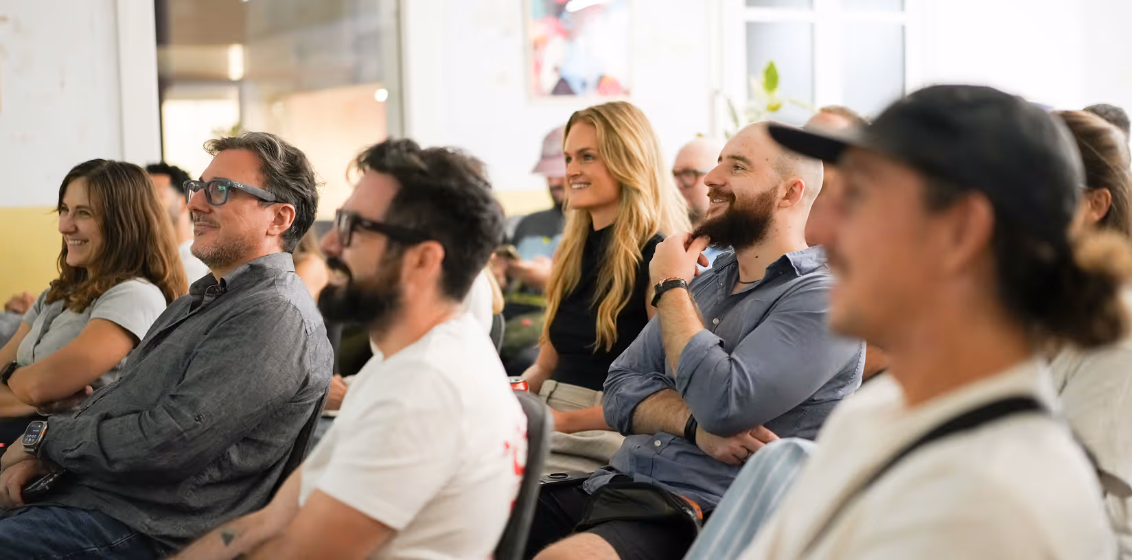 multiple people sitting in a crowd