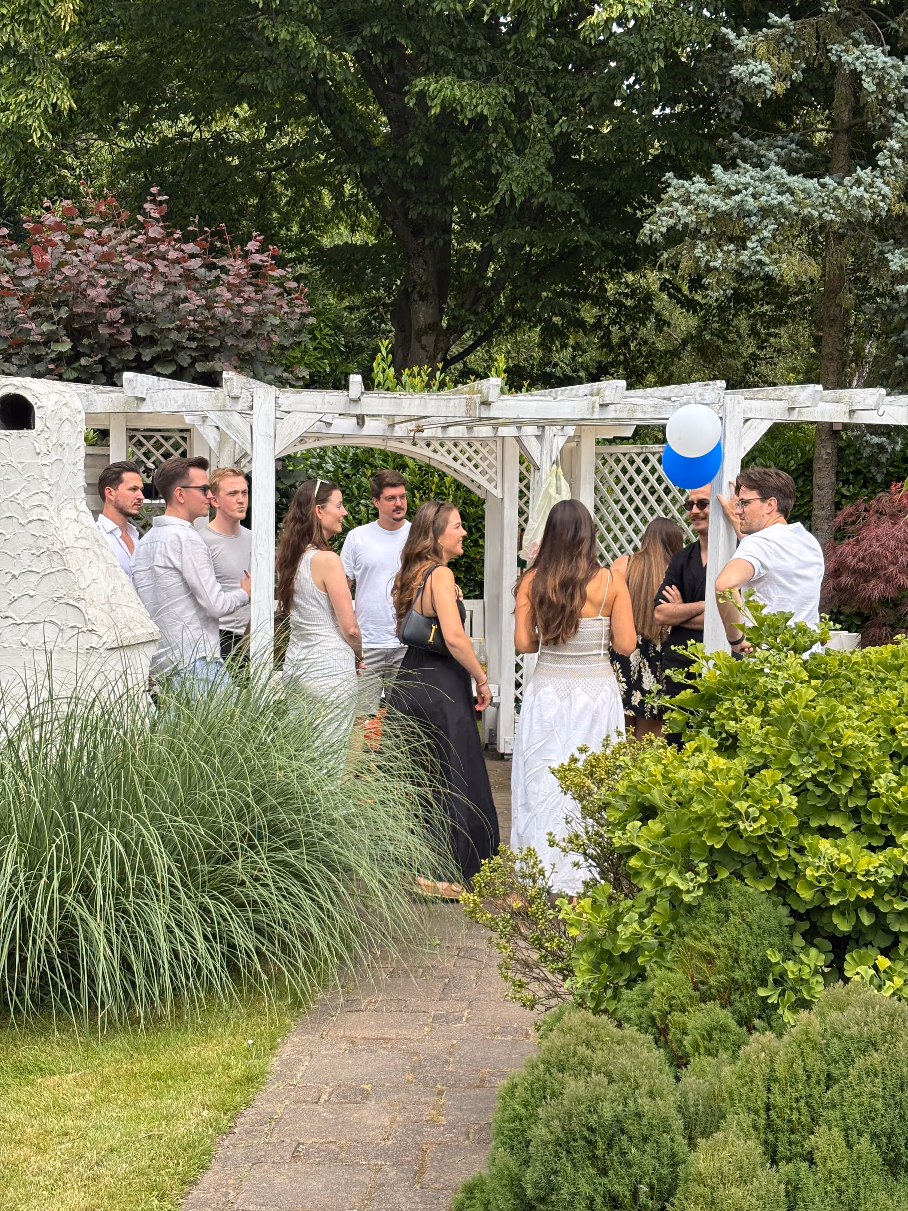 multiple people gathering in a garden