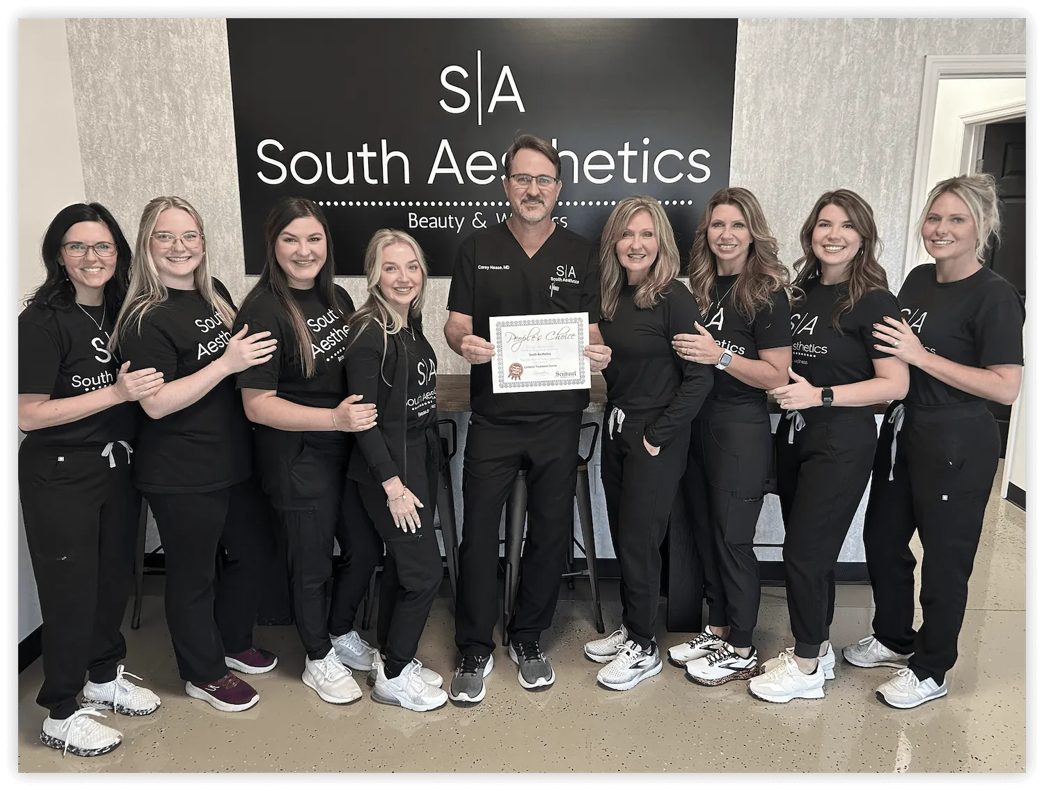 The South Aesthetics team with Dr. Carey Nease at the medical spa