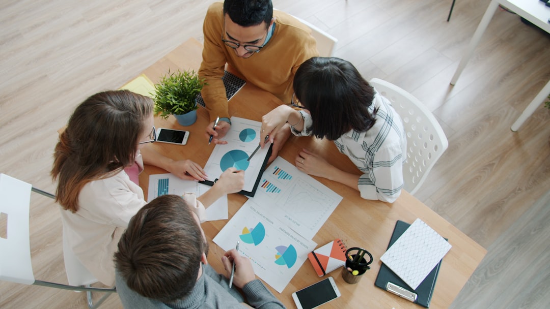 team collaborating on data charts - technical seo audit tampa team collaborating on data charts - technical seo audit tampa