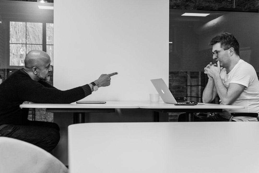 two professionals in a productive meeting - seo consultant two professionals in a productive meeting - seo consultant