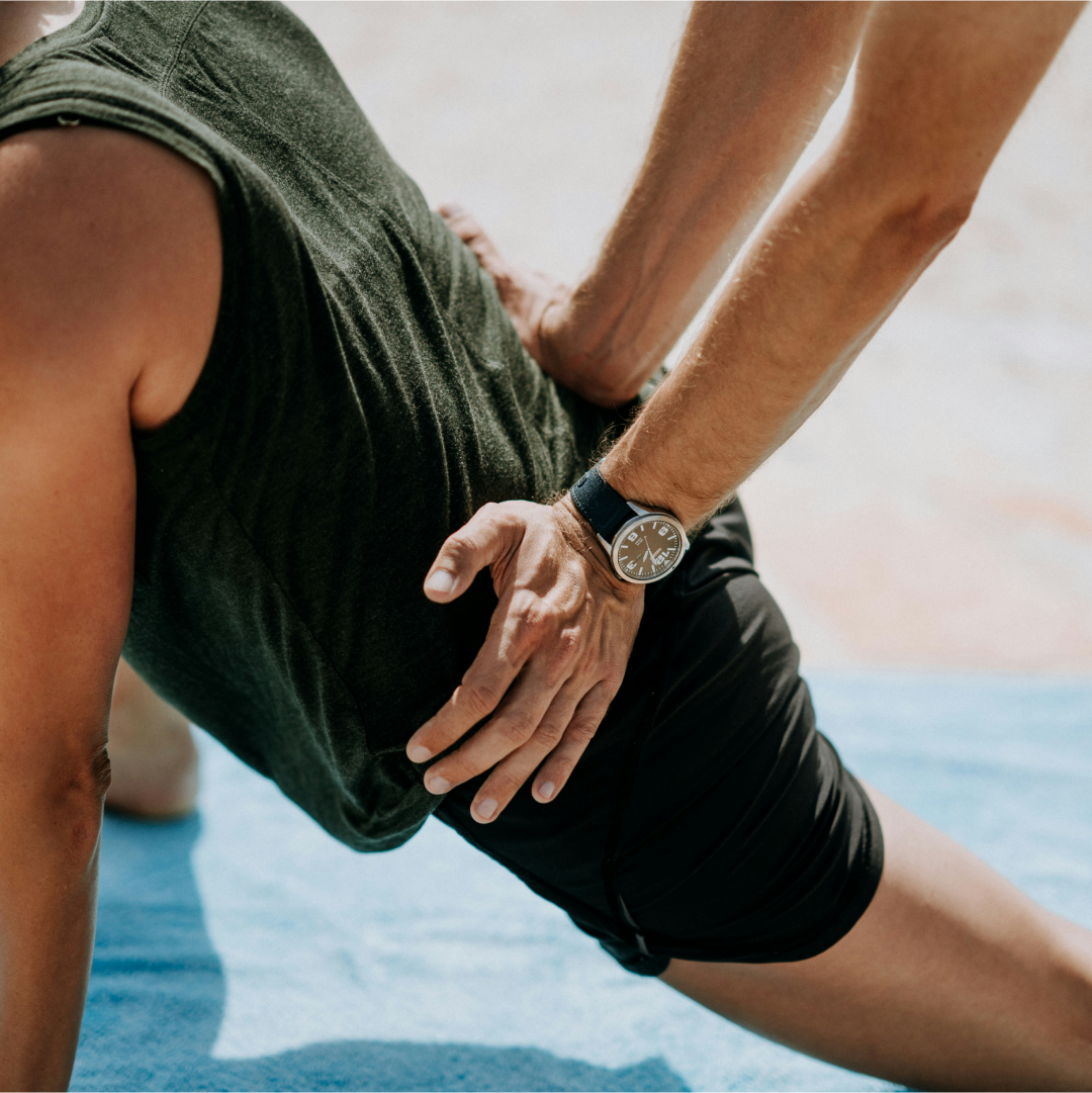 physio helping client with exercise