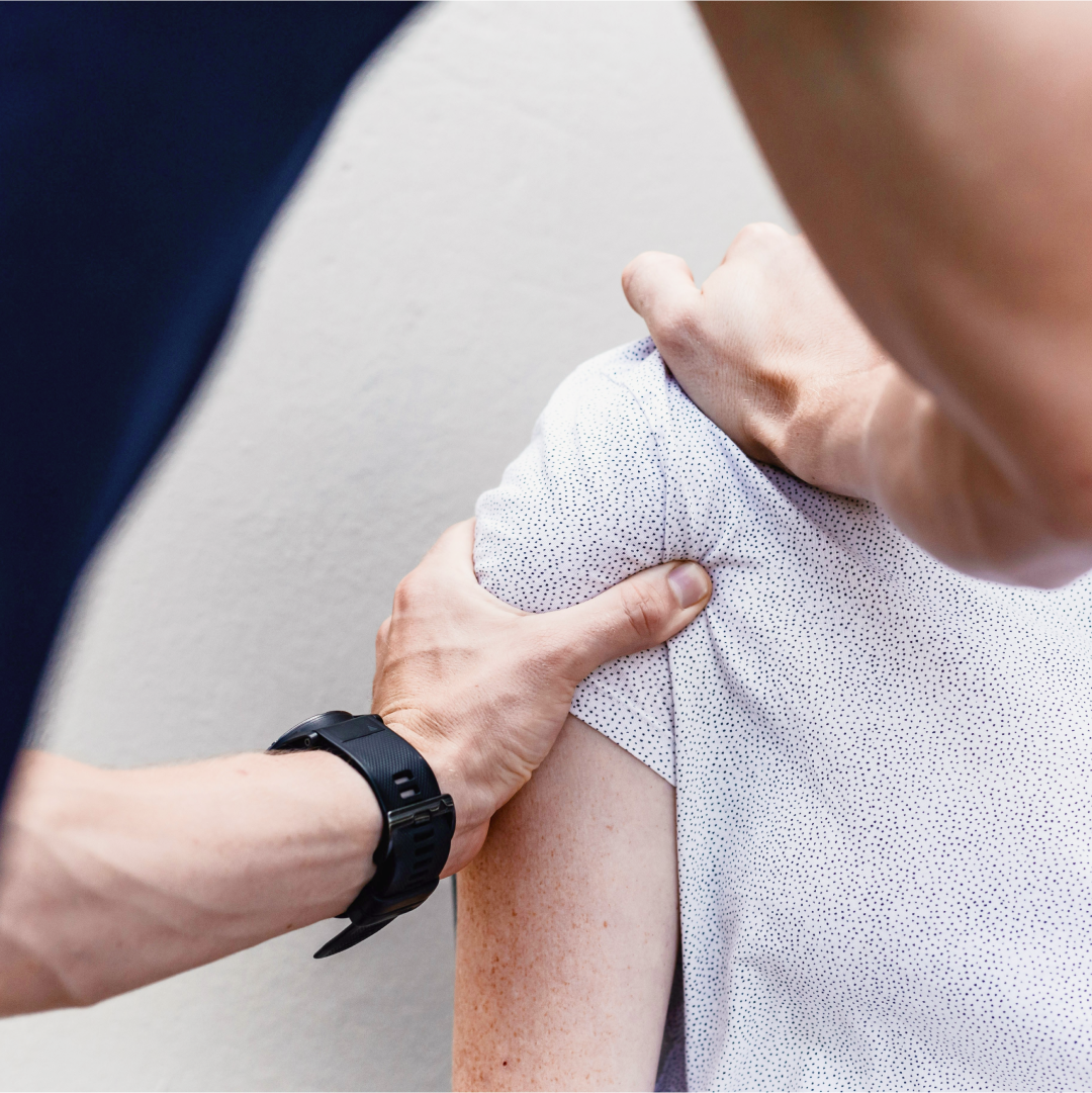 physio helping client with shoulder massage