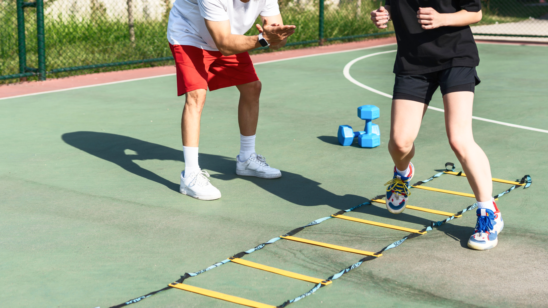 physio helping client with exercise
