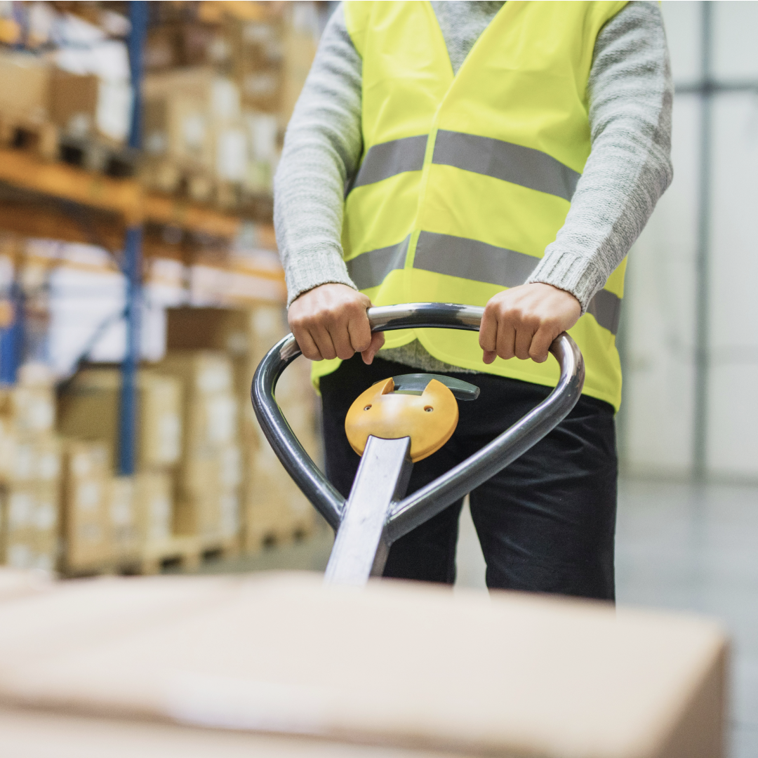 worker pulling trolley