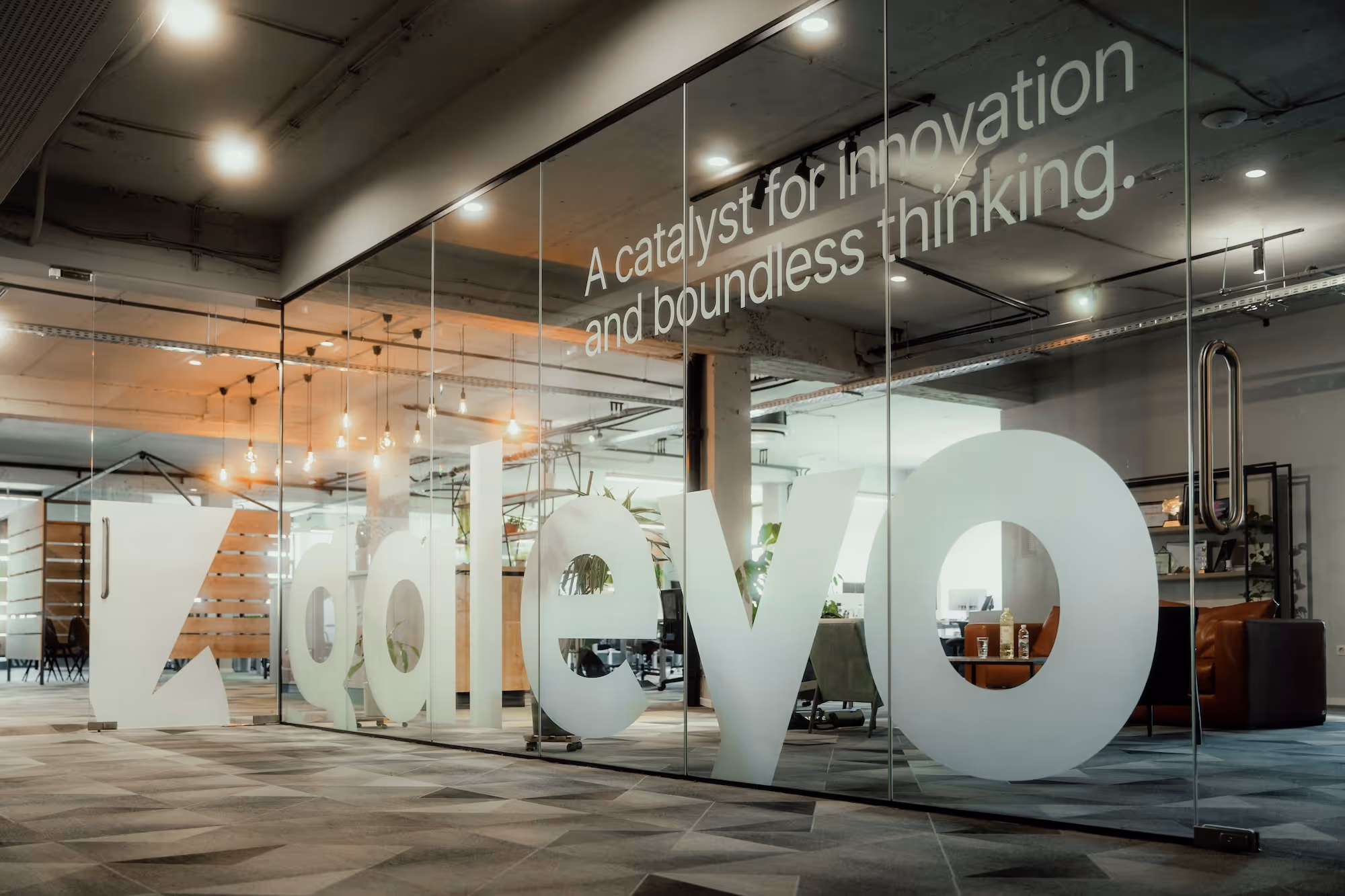 Galeyo logo on frosted glass office wall