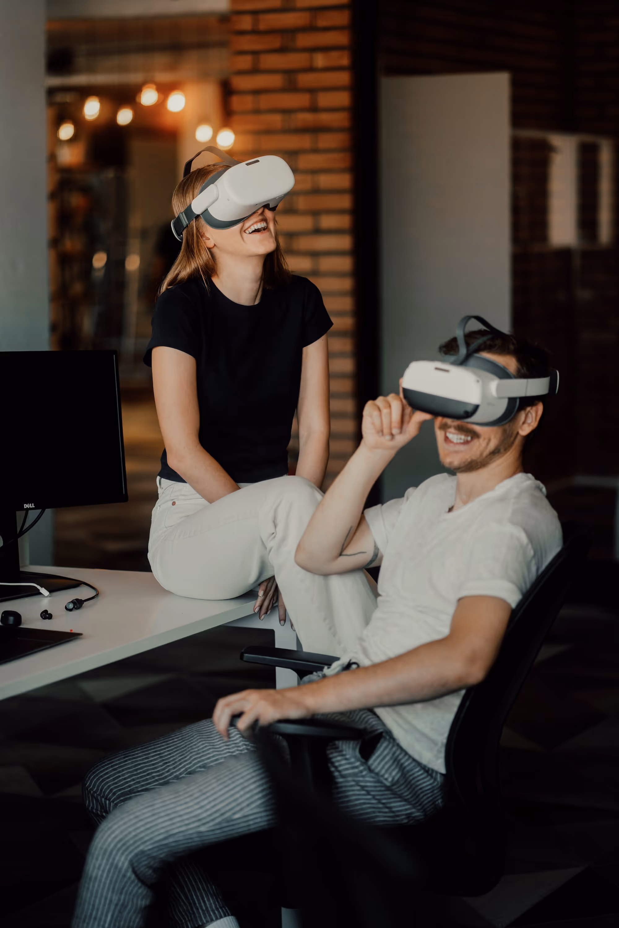Two people exploring virtual reality with VR headsets