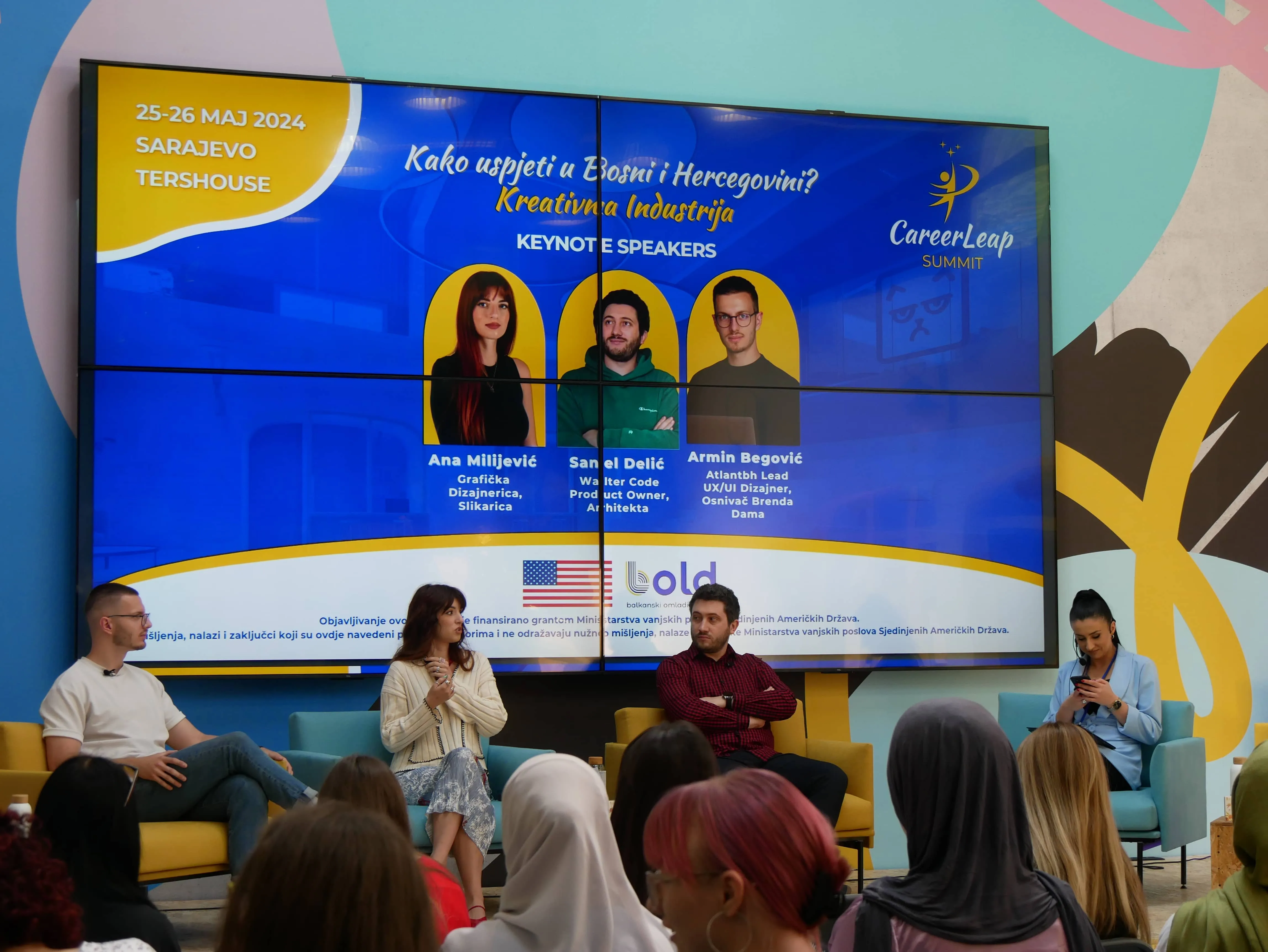 Presentation at youth event with Galeyo logo and stage screen