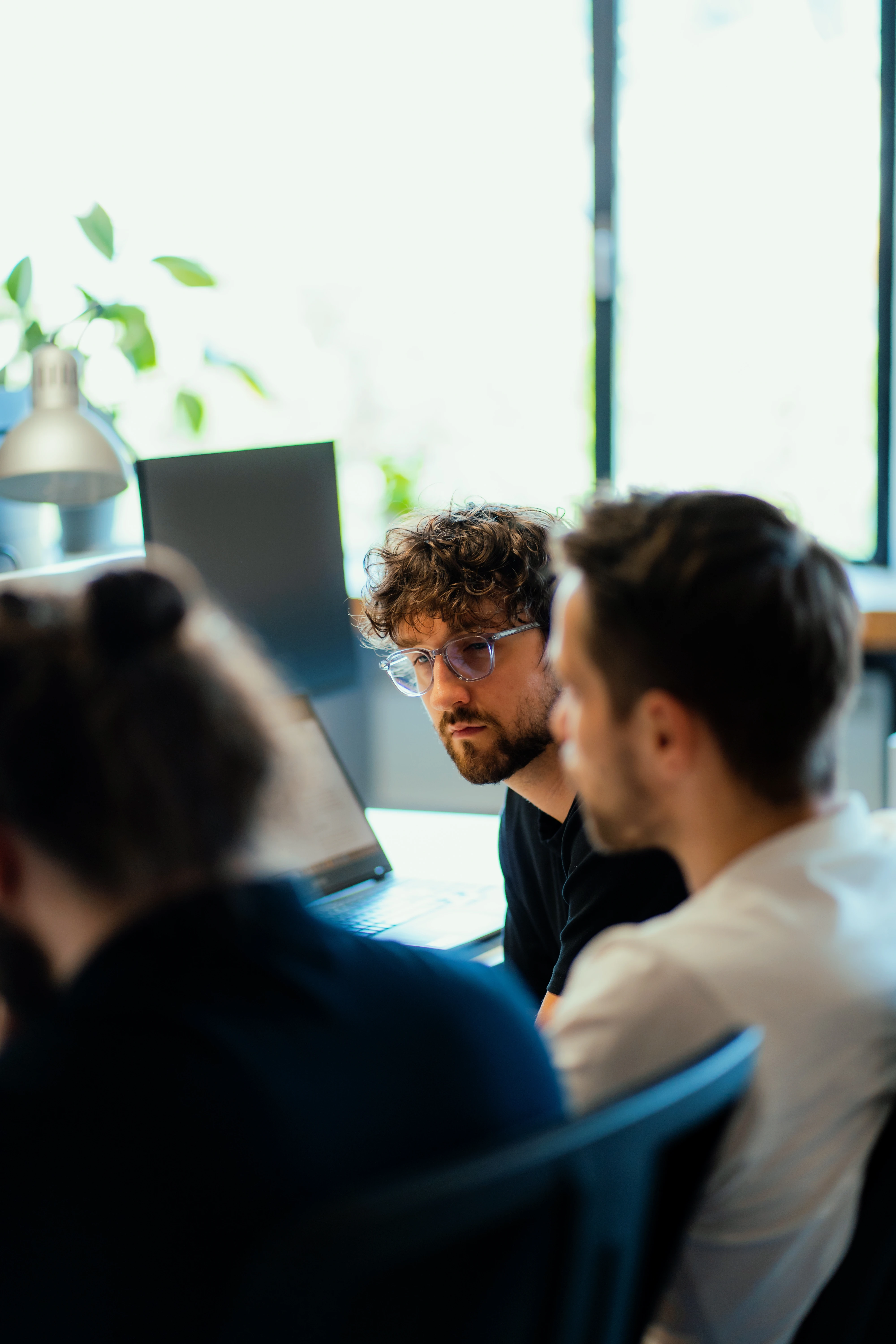 Galeyo team brainstorming product ideas in an open office environment