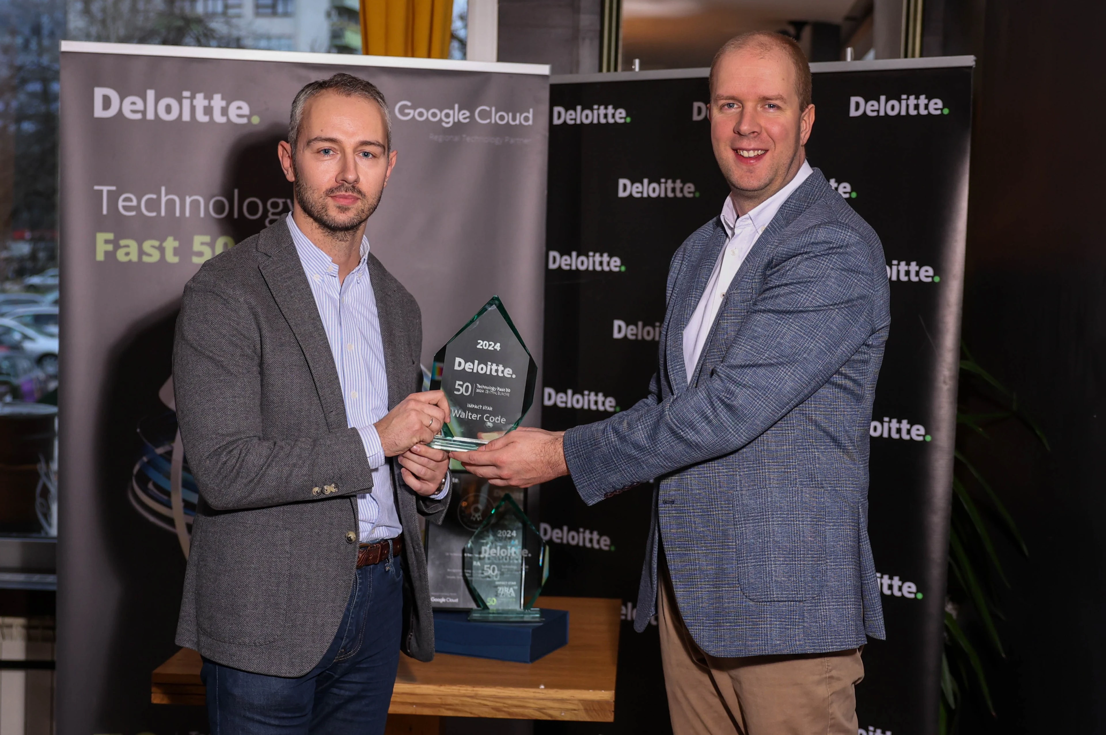 Galeyo receiving Deloitte Impact Star Award