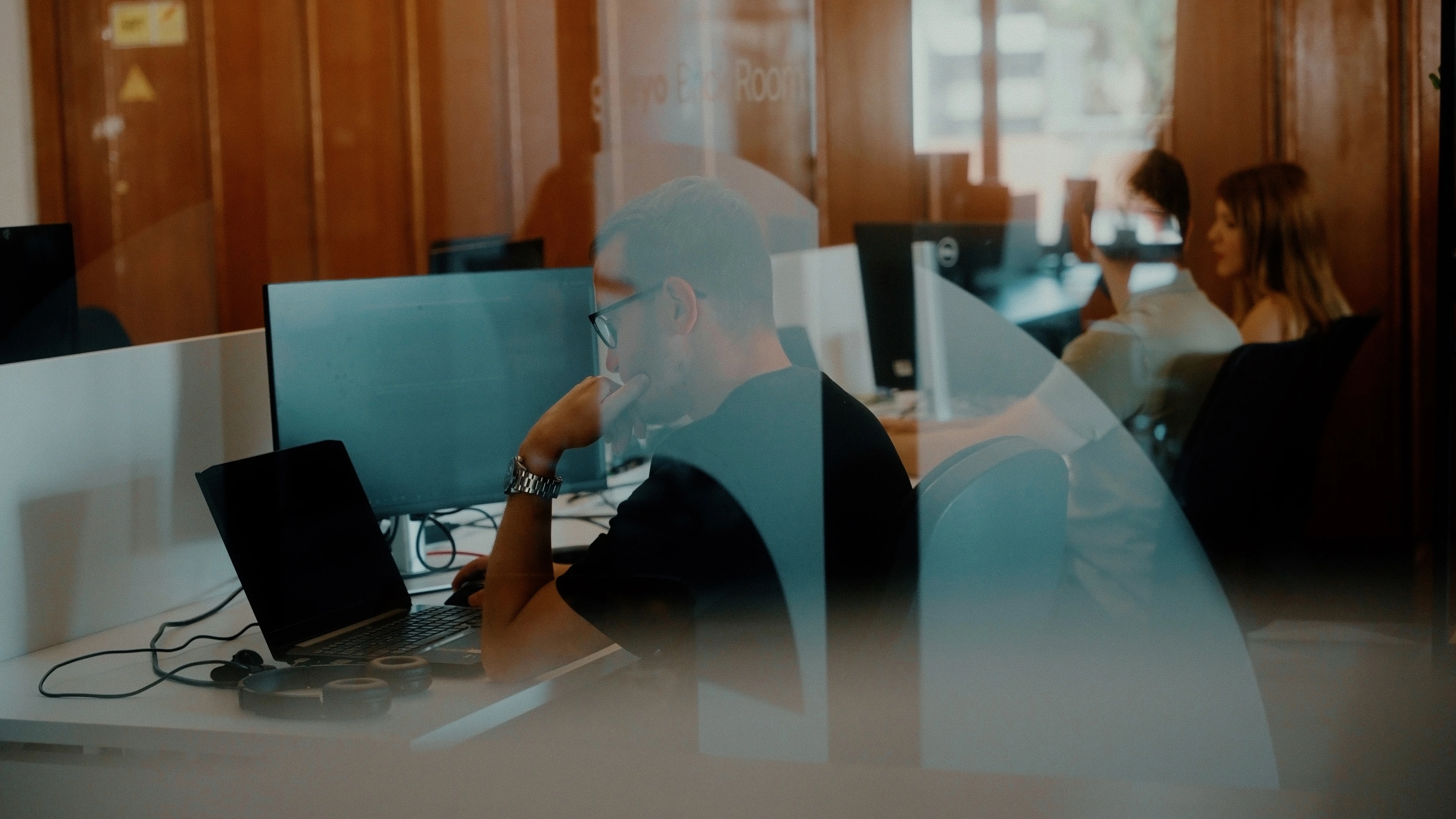 Galeyo team member working in the Mostar office, focused in a collaborative tech environment