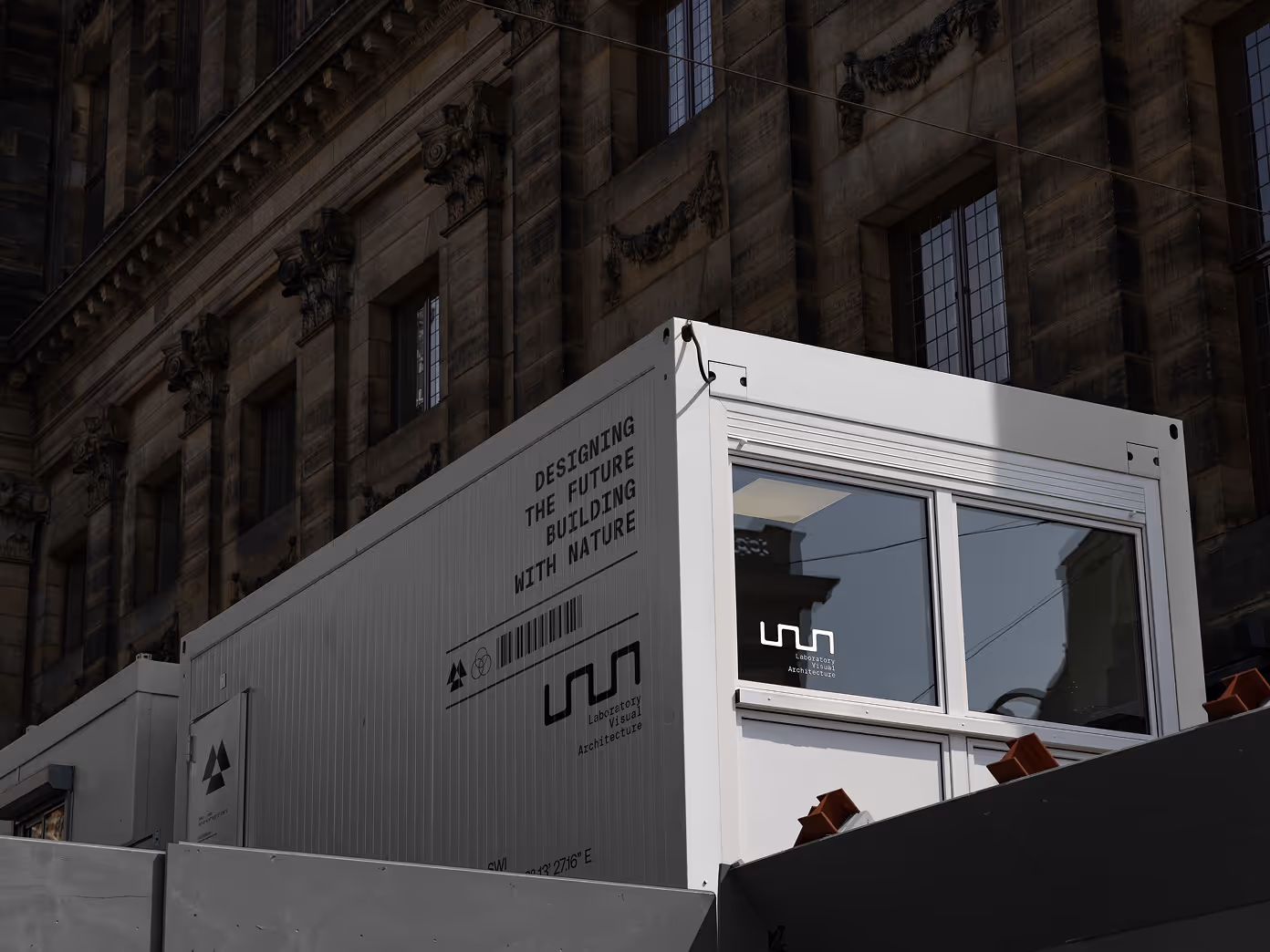 Branding applied to modular office units with slogan and logo integration.