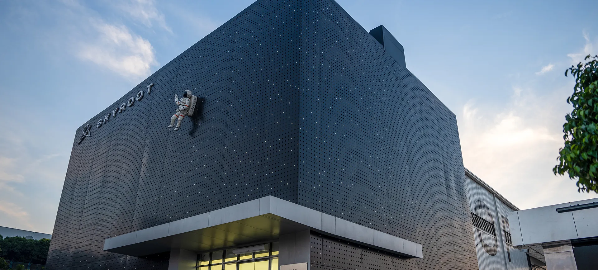 A building with a clock on the side of it.