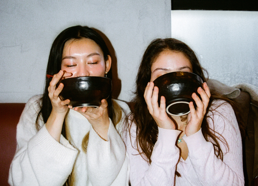 two friends enjoying dinner together