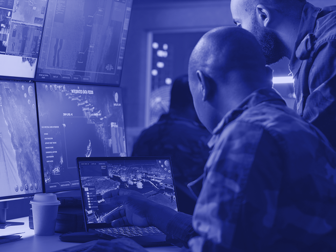 An illustration of command centers with computers and screens.