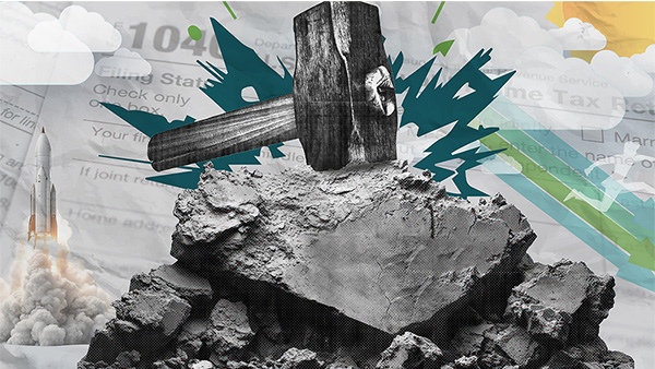 Sledgehammer striking a pile of stones