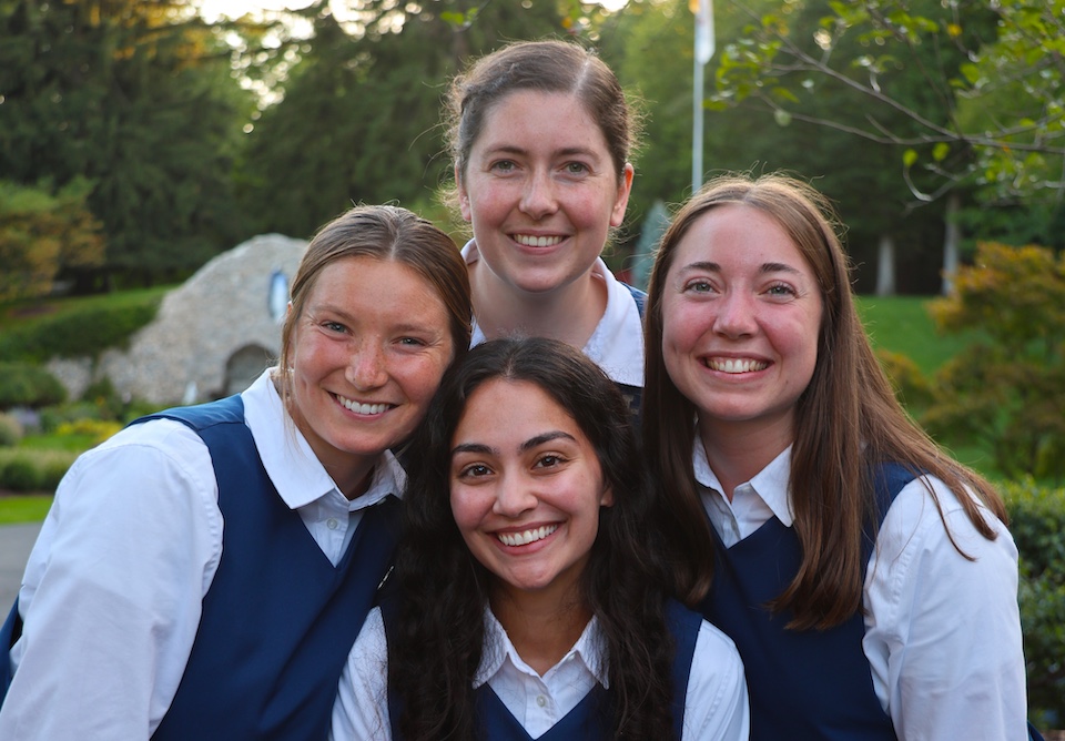 Four postulants posing for a photo