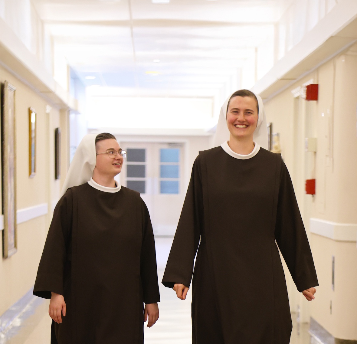 Two novices walking down the hall