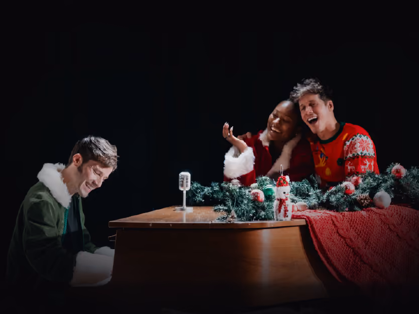 Holiday Sing Along Cast At Piano