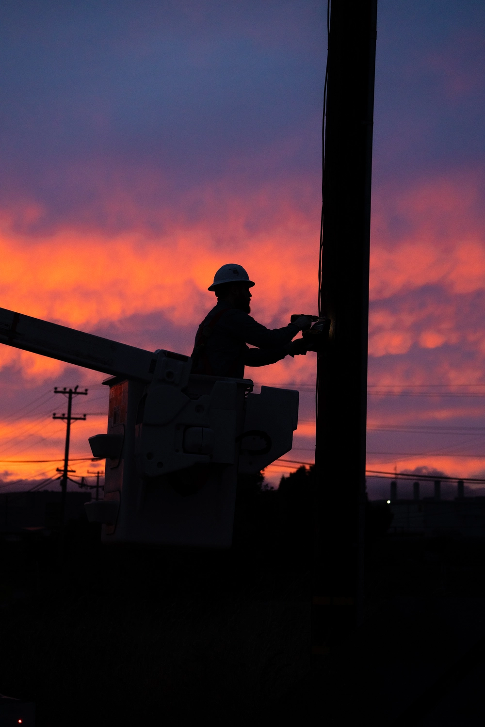 Lineman installing gridscope and sunset