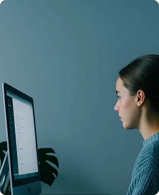 A woman in front of her laptop.