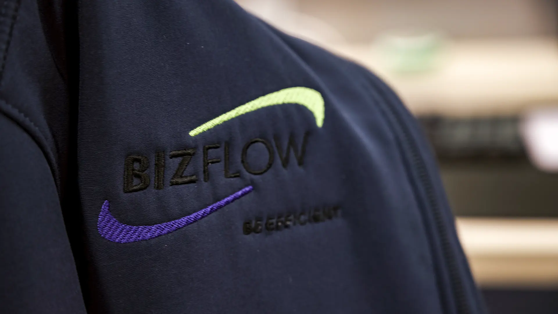 BizFlow logo on jacket