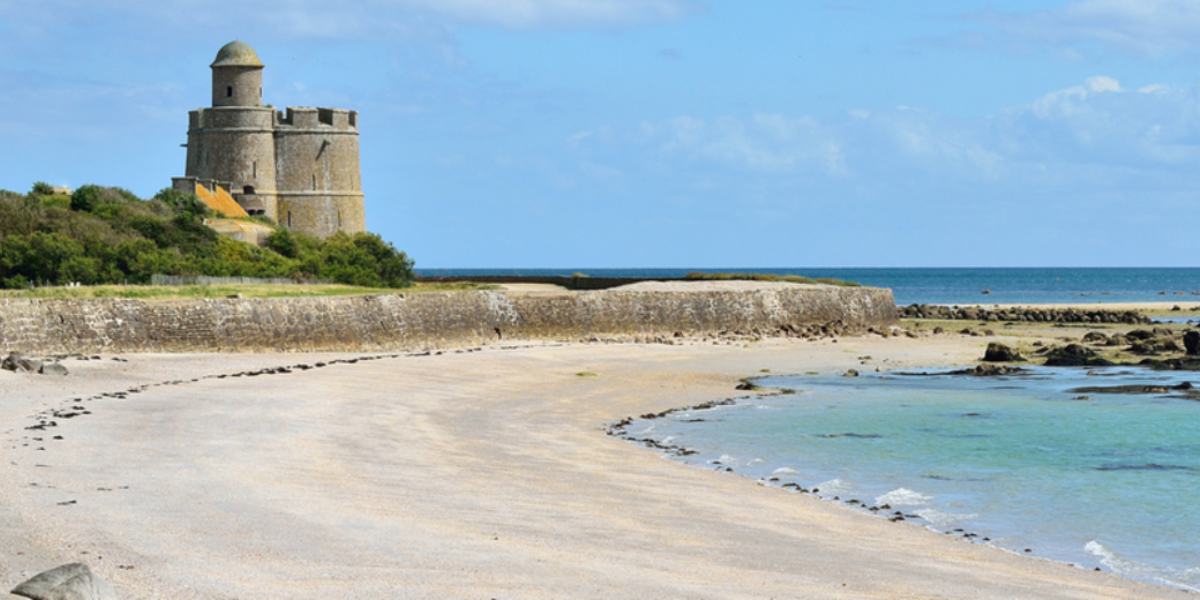 Tatihou Island and its Vauban Tower off Saint-Vaast-la-Hougue on the Normandy coast, France.