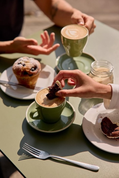 person having breakfast at Cafe Arcana - the uncommoner hotel ma