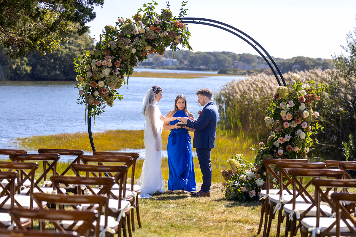 A group of women enjoying drinks on the banks of a creek