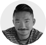 Portrait of Louis, Co-Founder and CTO of DreamSphere, smiling and wearing a striped shirt against a light background.

