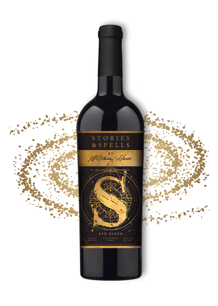 Black wine bottle labeled Stories & Spells overlayed over a golden galaxy image