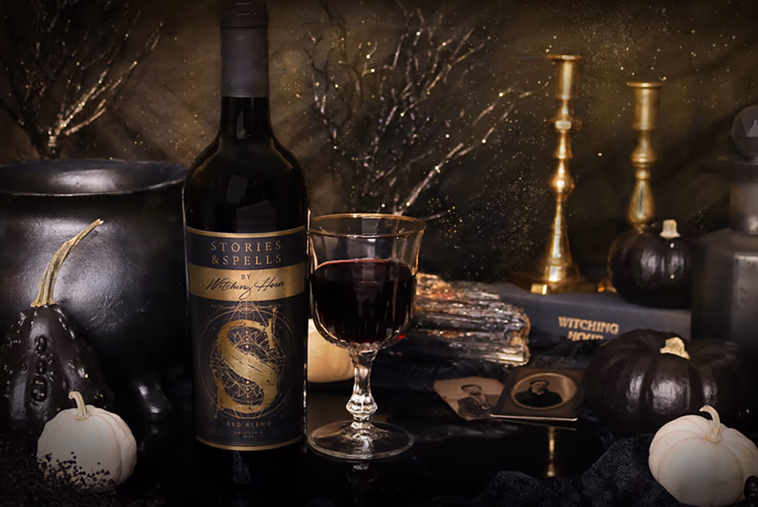 Image of Stories and Spells wine bottle with wine glass and dark witchy setting.