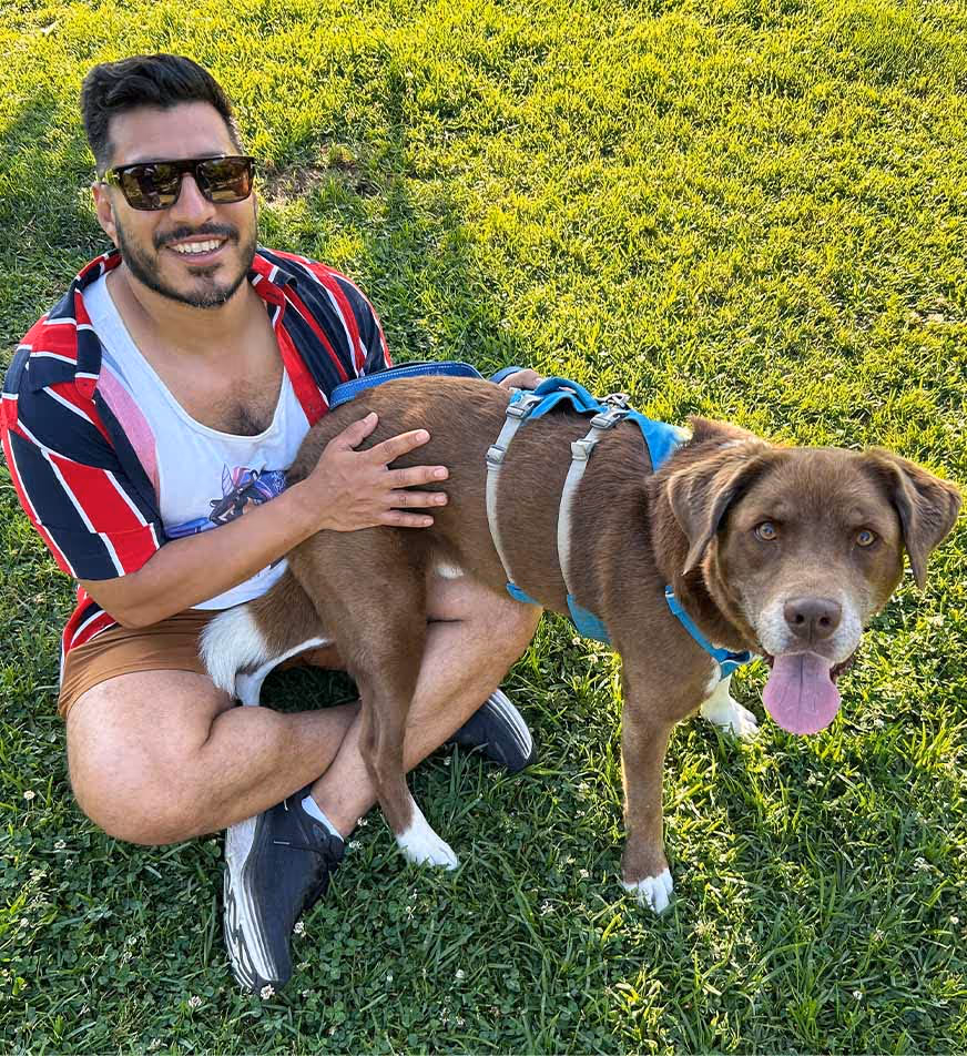 Latino man with chocolate lab